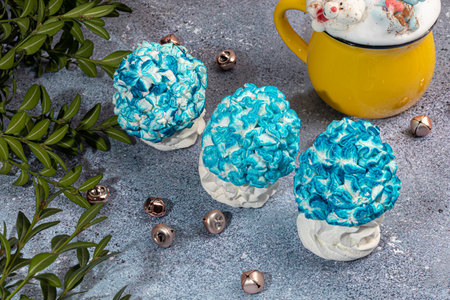 Handmade marshmallows on a light background in the form of roses, hydrangeas and tulips. There are flowers nearby. Womens day, Valentines day.の写真素材