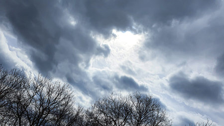 Blue sky with clouds. Road, exit from the occupied territories. War in Ukraine. Escape from the...