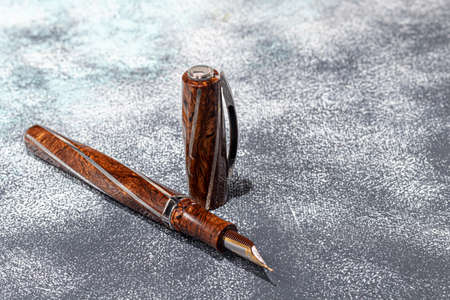 Fountain pen on a marble and gray background. selective focus. copyspace.の写真素材