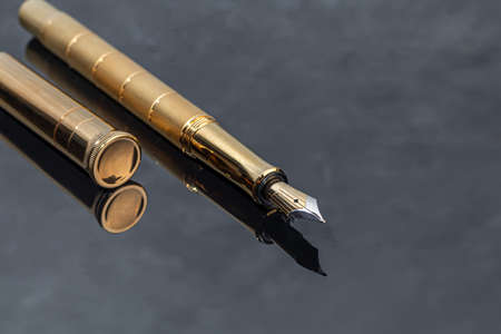 Fountain pen on a marble and gray background. Selective focus.の写真素材