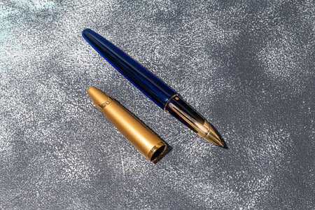 Fountain pen on a marble and gray background. Selective focus.の写真素材