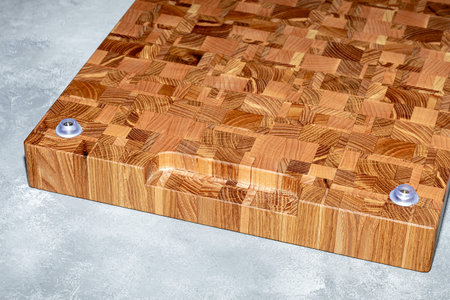 Wooden board for cutting handmade products with chopped vegetables. On a light background. copy...