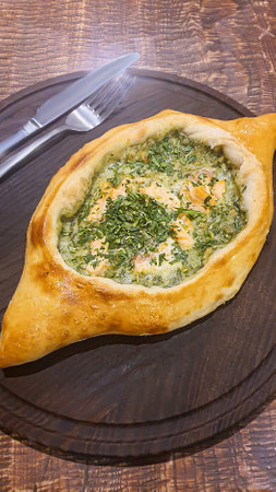 Georgian pastry dish. Pie with red fish and spinach.の写真素材