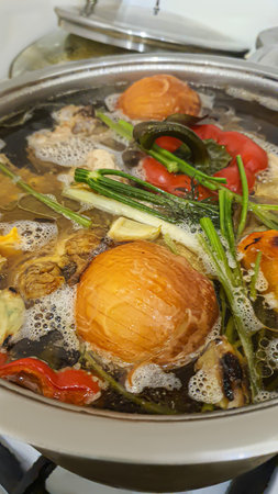 Waste-free food preparation. Soup with onions, peppers, herbs,carrots in bone broth. ecological...
