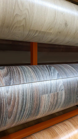 The store sells multi-colored laminate flooring. Repair and construction, large rollsの写真素材