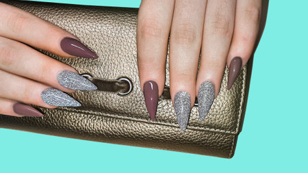 Manicure and nail extension with acrylic and gel. The design is made with reflective gel polishes. copy spaceの写真素材