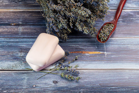 Bouquet of dried lavender, lavender soap, oil and candle tea. Healthy lifestyle, light background. copy spaceの写真素材