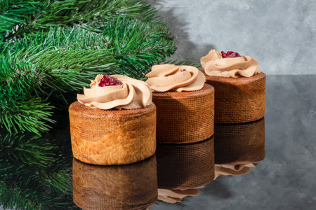 Cakes filled with cream and cherry jam. Box eclairs. New Year and holiday concept. Copy spaceの写真素材