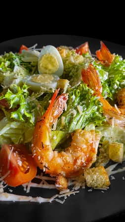Vegetable and fish salad with tomatoes, cucumbers and avocado. Boiled egg. Bowl. Copy spaceの写真素材