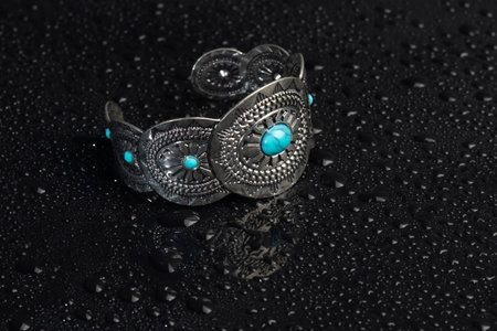 Bracelets. Womens jewelry on a dark background. Metal products. Fashion.