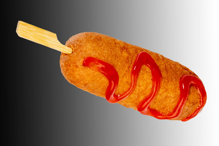 Corn dogs with different fillings and different sauces. isolated on background.の写真素材