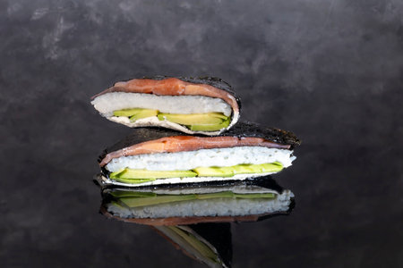 Sushi sandwiches with salmon, avocado, soy sauce, ginger. Sushi menu Japanese Asian food. Copy spaceの写真素材