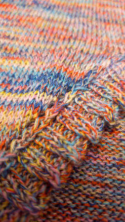 Knitted product from colored threads. Ready-made handmade women's sweater. Copy spaceの写真素材