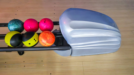 Sports hall for bowling. Pin lanes and colorful balls. Family recreation. Healthy lifestyle