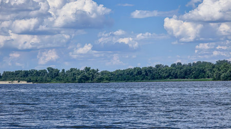 River surrounded by trees. Camping Volumetric clouds. Outdoor recreation.