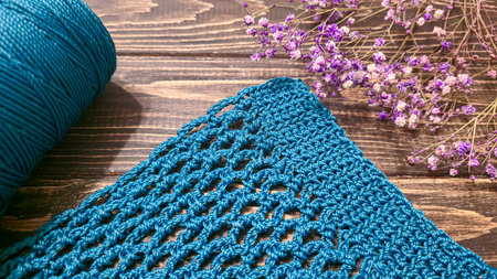 Knitting a product from green threads with a crochet hook. Step-by-step instructions for knitting a...