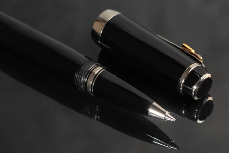 Branded pen in a box. Gift set. Selective focus. Office interior. Copy spaceの写真素材