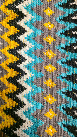 Crochet pattern of multicolored threads Yellow with gray, black and other colorsの写真素材
