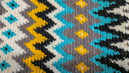 Crochet pattern of multicolored threads Yellow with gray, black and other colorsの写真素材
