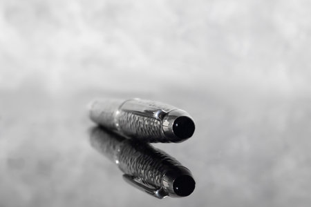 Fountain pen on marble gray background. Gift set. Office interior.