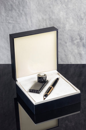 Fountain pen on dark marble background. Rare writing instruments. Selective focus.の写真素材