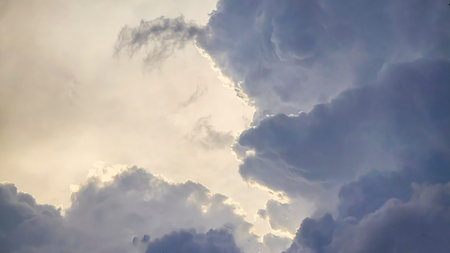 Blue sky with clouds, thunderclouds, summer weather. Sunset. White clouds. Rain.