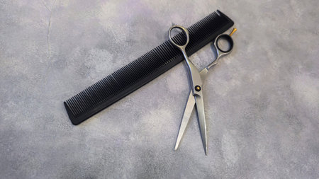Special hairdressing scissors and comb. Professional equipment.