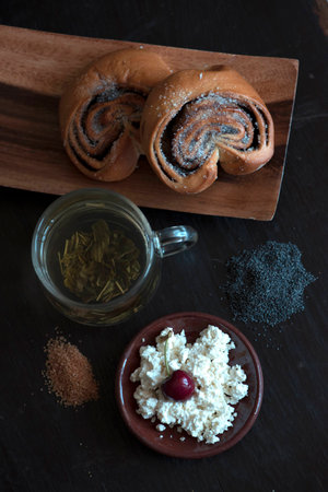 Sweet rolls with cottage cheese and green teaの写真素材