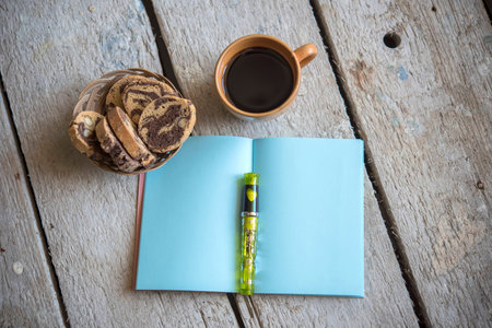 Coffee Cup with notebook  and pen