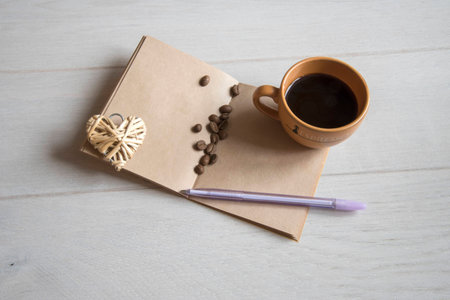 Coffee Cup with notebook  and penの写真素材