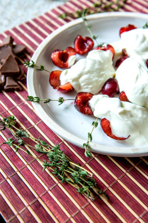 Cherry sour cream on the tableの写真素材