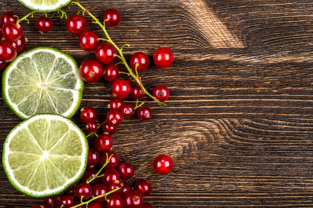 Lime, red currant, top view, place for textの写真素材
