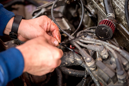 Mechanic working in auto repair garage. Car maintenanceの写真素材