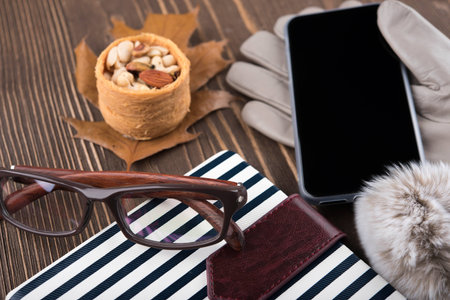 Nuts, gloves, phone, glasses, Notepad in blue stripes