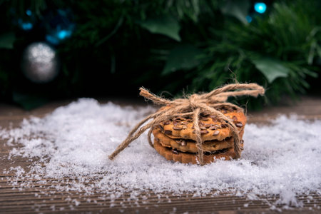 Cookies in the snow, Christmas balls,Christmas decoration in the backgroundの写真素材