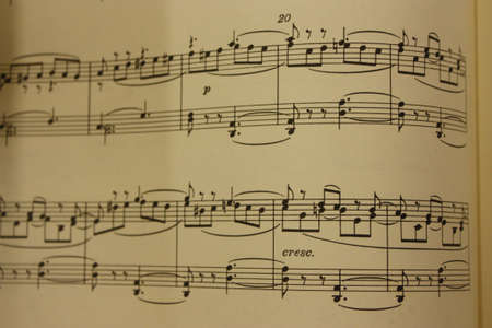 Sheet music printed on beautiful, old and yellowed paper. Musical scoreの写真素材