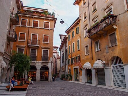 Verona, Italy - September 2, 2012: a small square of Verona with old yellow buildingsのeditorial素材