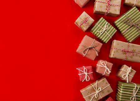 lots of gift boxes on a colored background for a holiday cardの写真素材