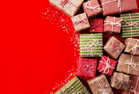 lots of gift boxes on a colored background for a holiday cardの写真素材