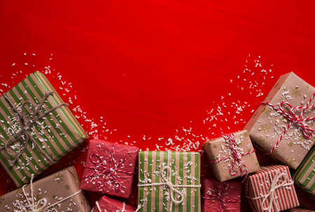 lots of gift boxes on a colored background for a holiday cardの写真素材
