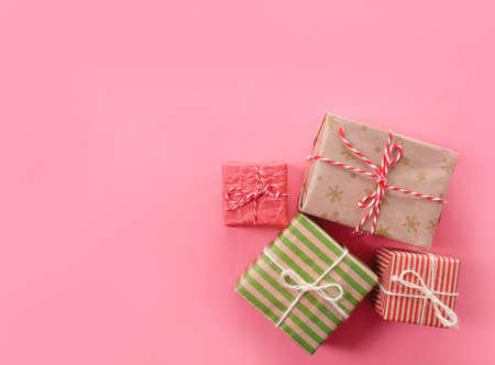 lots of Christmas gifts on pink background.の写真素材