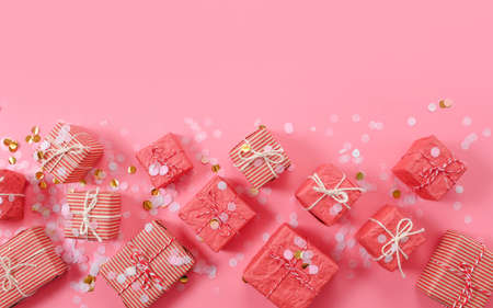 lots of Christmas gifts on pink background.の写真素材