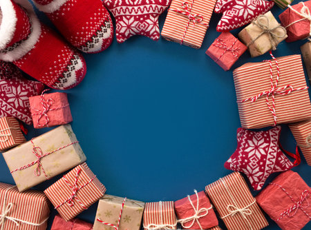 lots of Christmas gifts on a blue background.