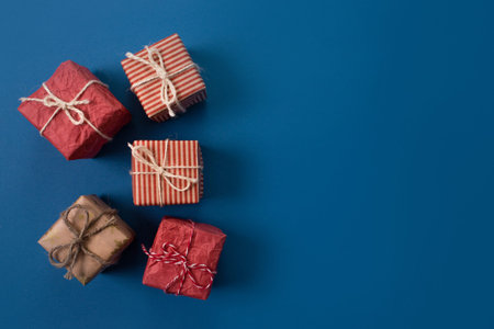 lots of Christmas gifts on pink background.