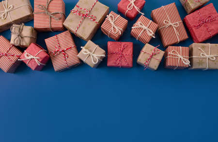 lots of Christmas gifts on pink background.の写真素材