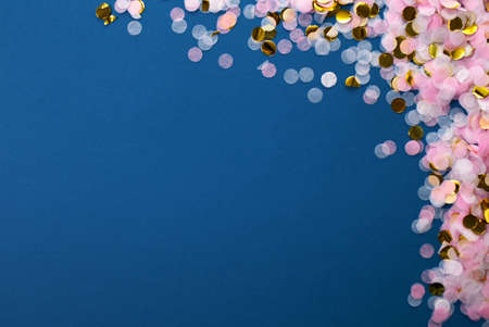 Classic blue 2021.confetti on a blue background. Frame of colored confetti.の写真素材