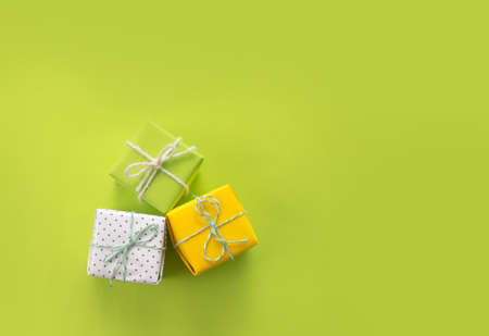 lots of Christmas gifts on yellow background.の写真素材