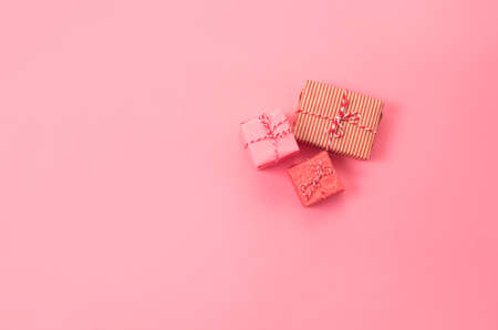 lots of Christmas gifts on pink background.の写真素材