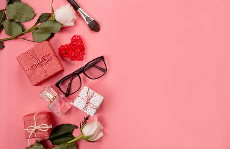 Fashionable composition with women's accessories on a pink background.の写真素材