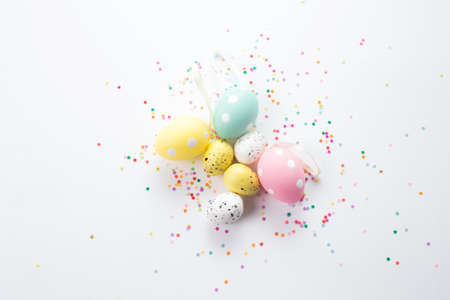 Easter composition of boxes and colorful eggs on a light background.の写真素材